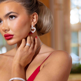 Rankins Jewellers Model wearing white gold and diamond ring and heart earrings